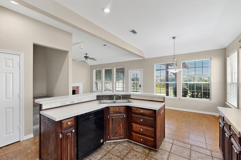 2104 Old McGarrah Road McKinney, TX 75072 - Photo 6 of 39 a kitchen with a stove a sink and a window