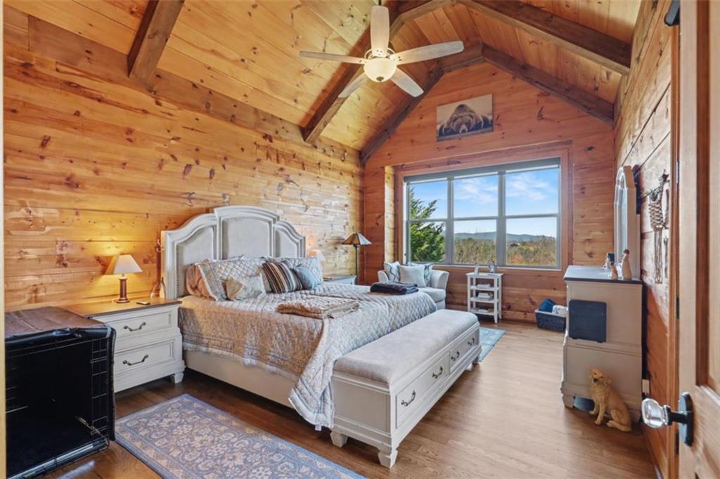 899 Ridge Pointe Way Blairsville, GA 30512 - Photo 29 of 88 a bed room with a bed and a large window