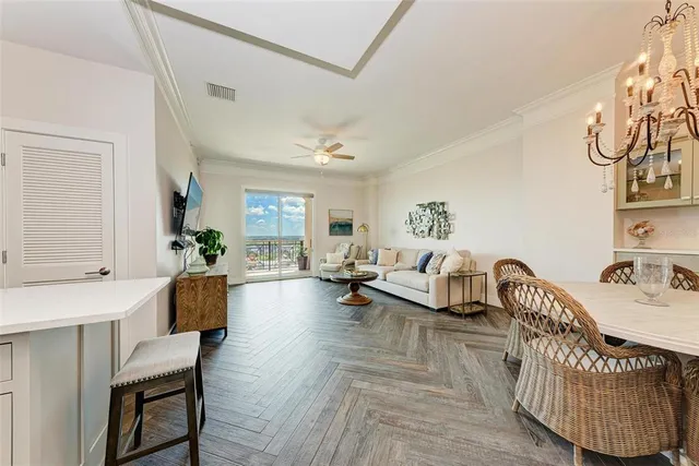 a kitchen with stainless steel appliances white cabinets and a refrigerator