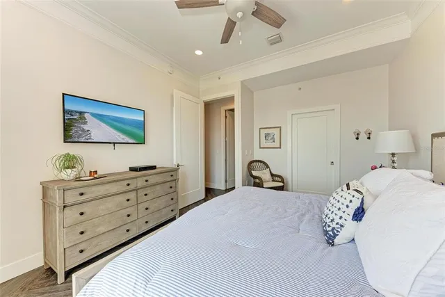 a bedroom with a bed and a chandelier