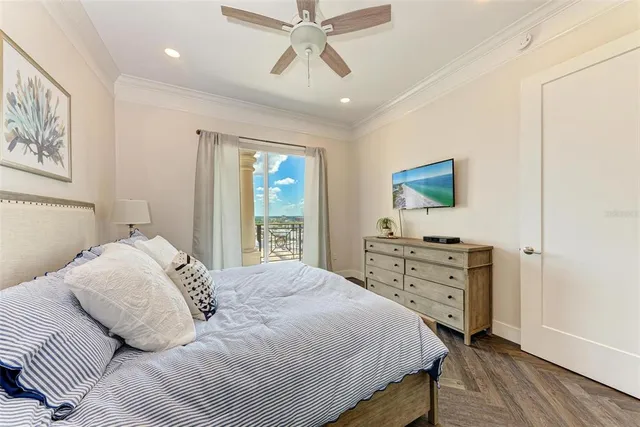 a view of a bedroom with furniture and balcony