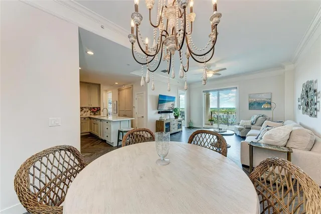 a kitchen with granite countertop white cabinets and stainless steel appliances