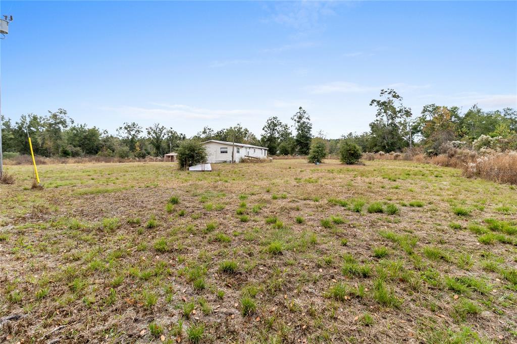601 Southwest Quarry Circle Fort White, FL 32038 - Photo 3 of 21 a view of field with trees in background