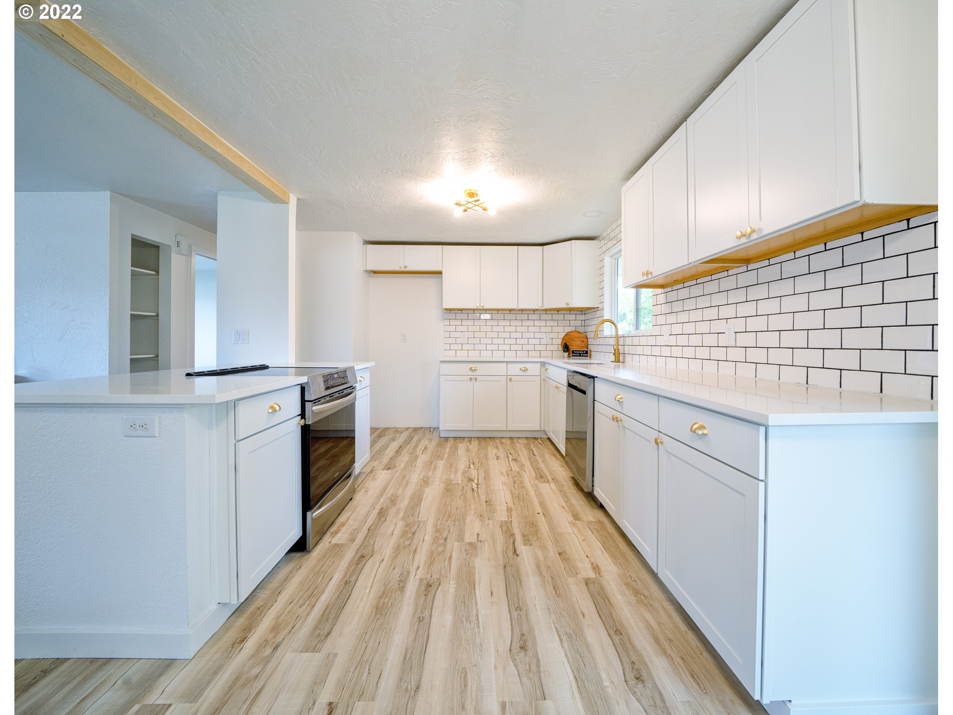 1936 D Street Springfield, OR 97477 - Photo 8 of 22 a kitchen with cabinets a sink and appliances