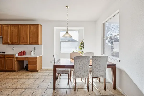 a view of a dining room with furniture window and outside view