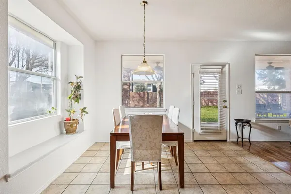 a view of a dining room with furniture window and outside view