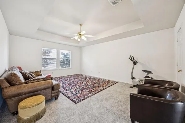 a living room with furniture and a window