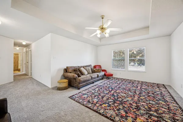 a living room with furniture and a rug