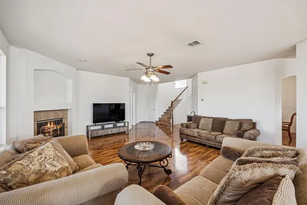 a living room with furniture and a fireplace