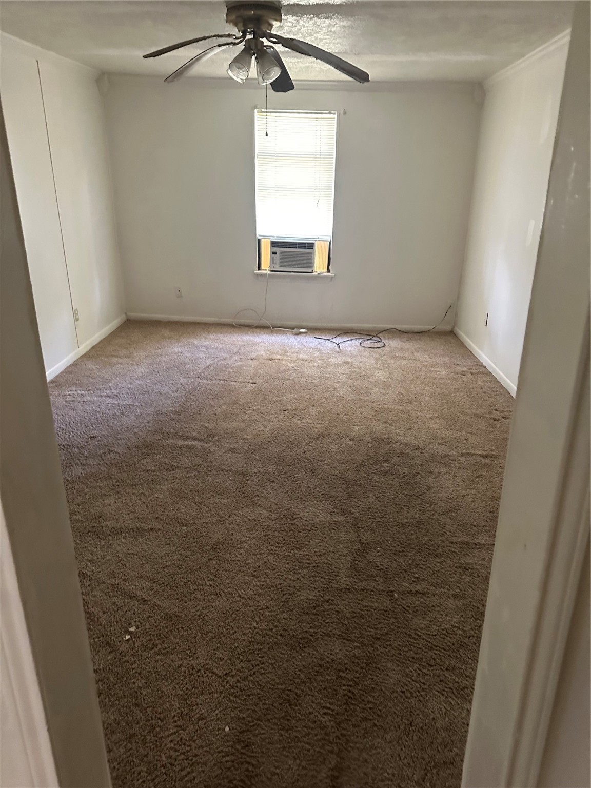 409 7th Street Huntsville, TX 77320 - Photo 13 of 17 an empty room with a window