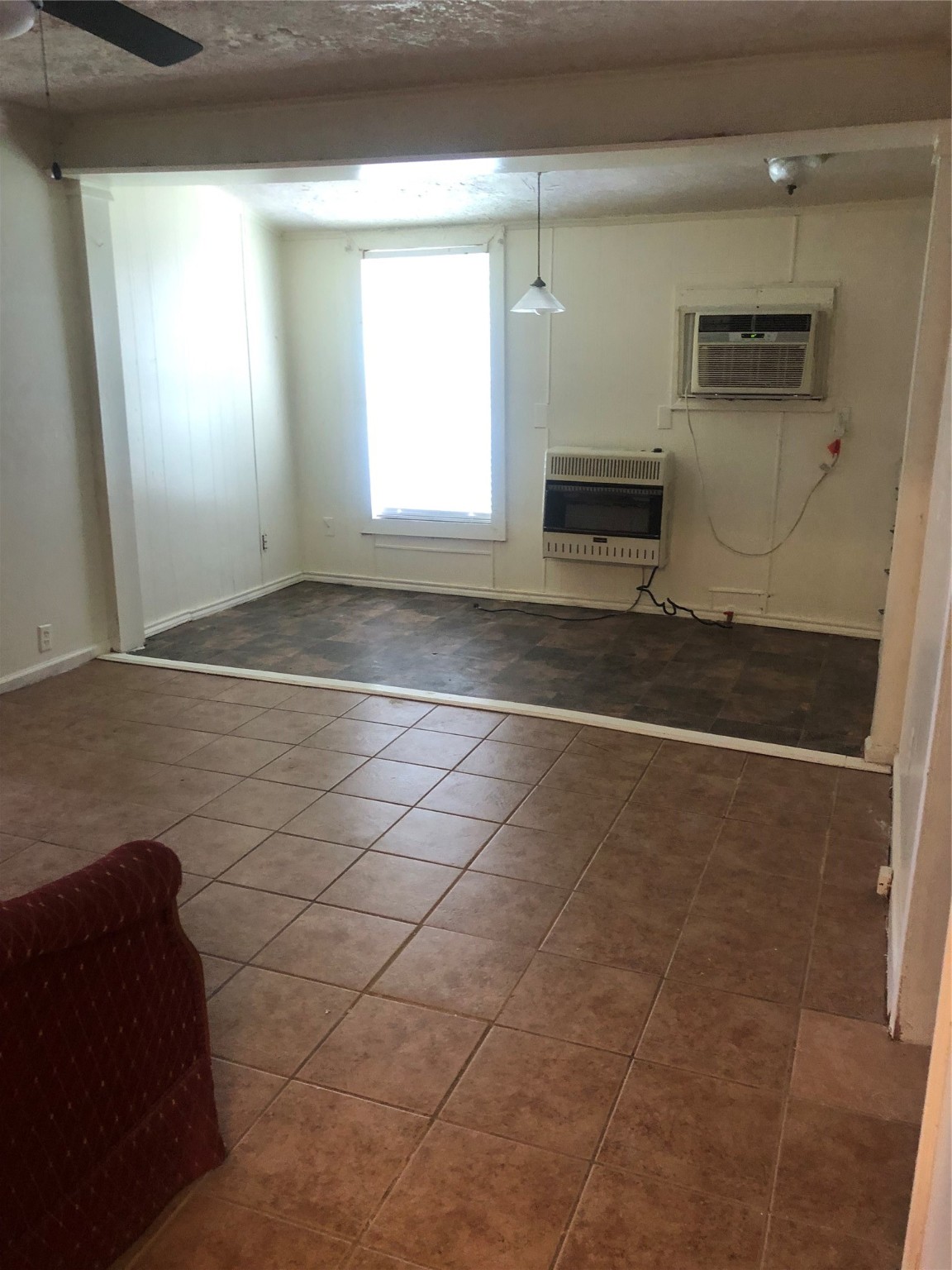 409 7th Street Huntsville, TX 77320 - Photo 8 of 17 a view of empty room with window and fireplace
