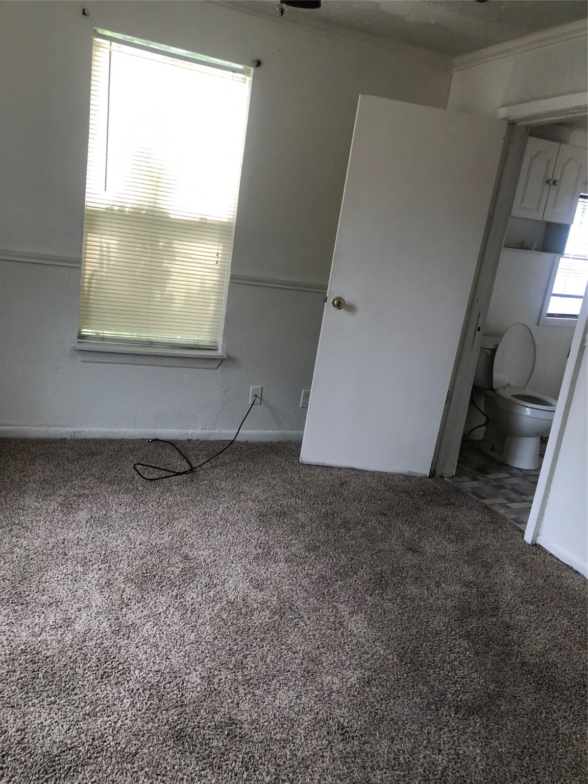 409 7th Street Huntsville, TX 77320 - Photo 10 of 17 a view of a livingroom with wooden floor and window