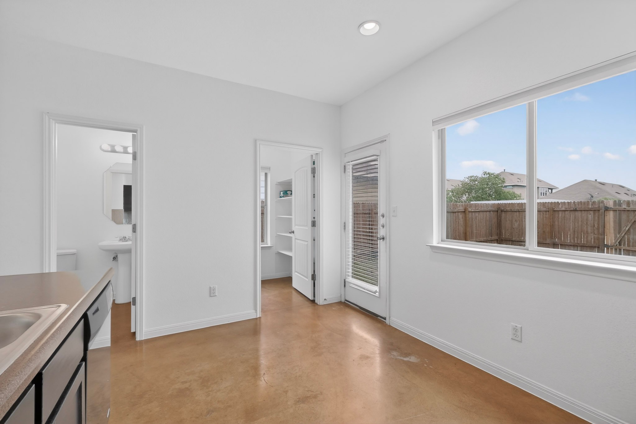 4619 Inicio Lane Austin, TX 78725 - Photo 12 of 32 a view of an empty room with a window