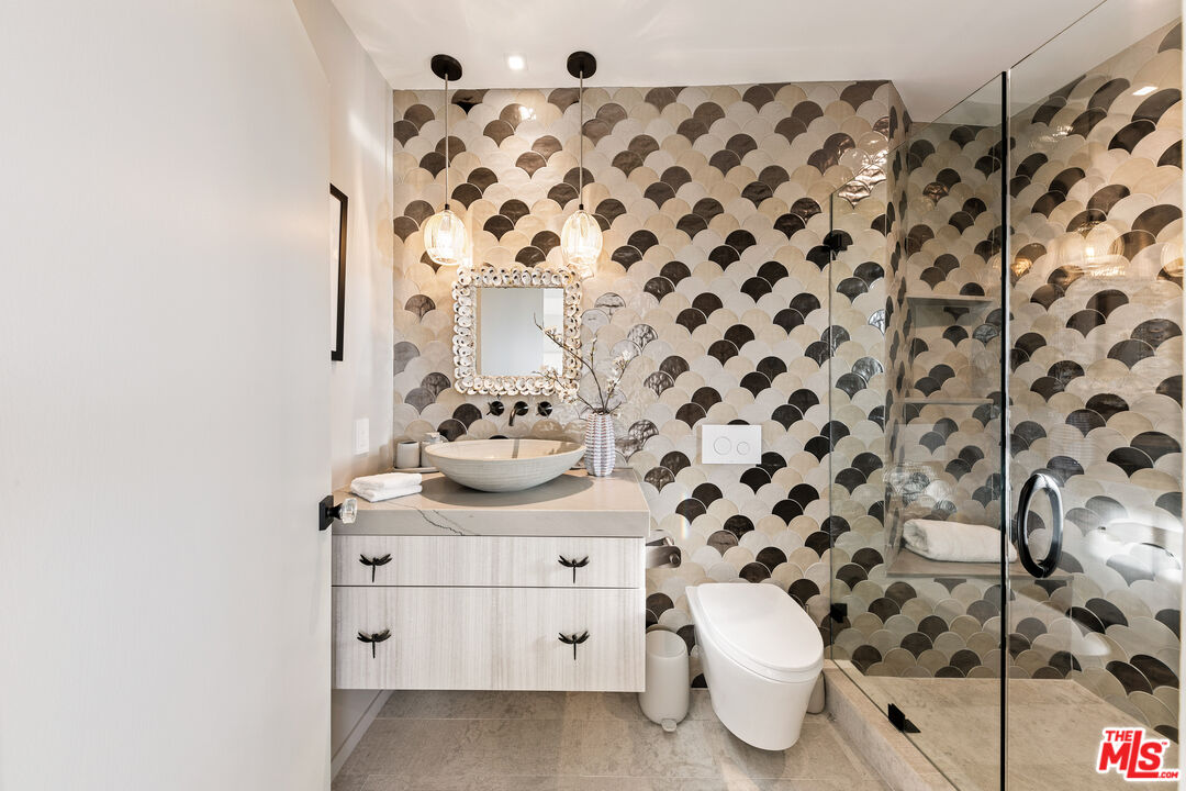 31558 Victoria Point Road Malibu, CA 90265 - Photo 45 of 55 a bathroom with a sink and a mirror