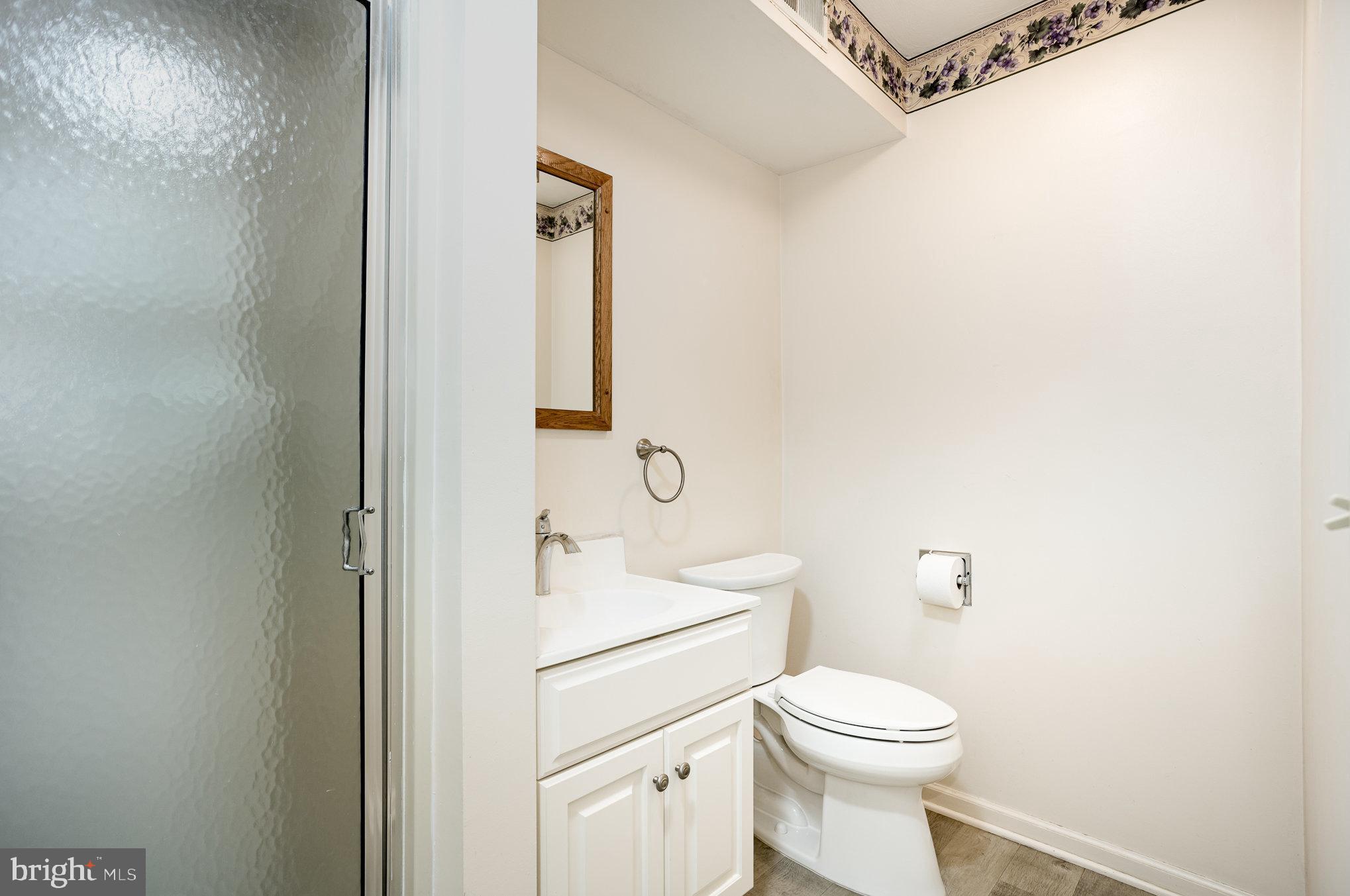 415 Weldon Drive York, PA 17404 - Photo 18 of 34 a white toilet sitting next to a bathroom sink