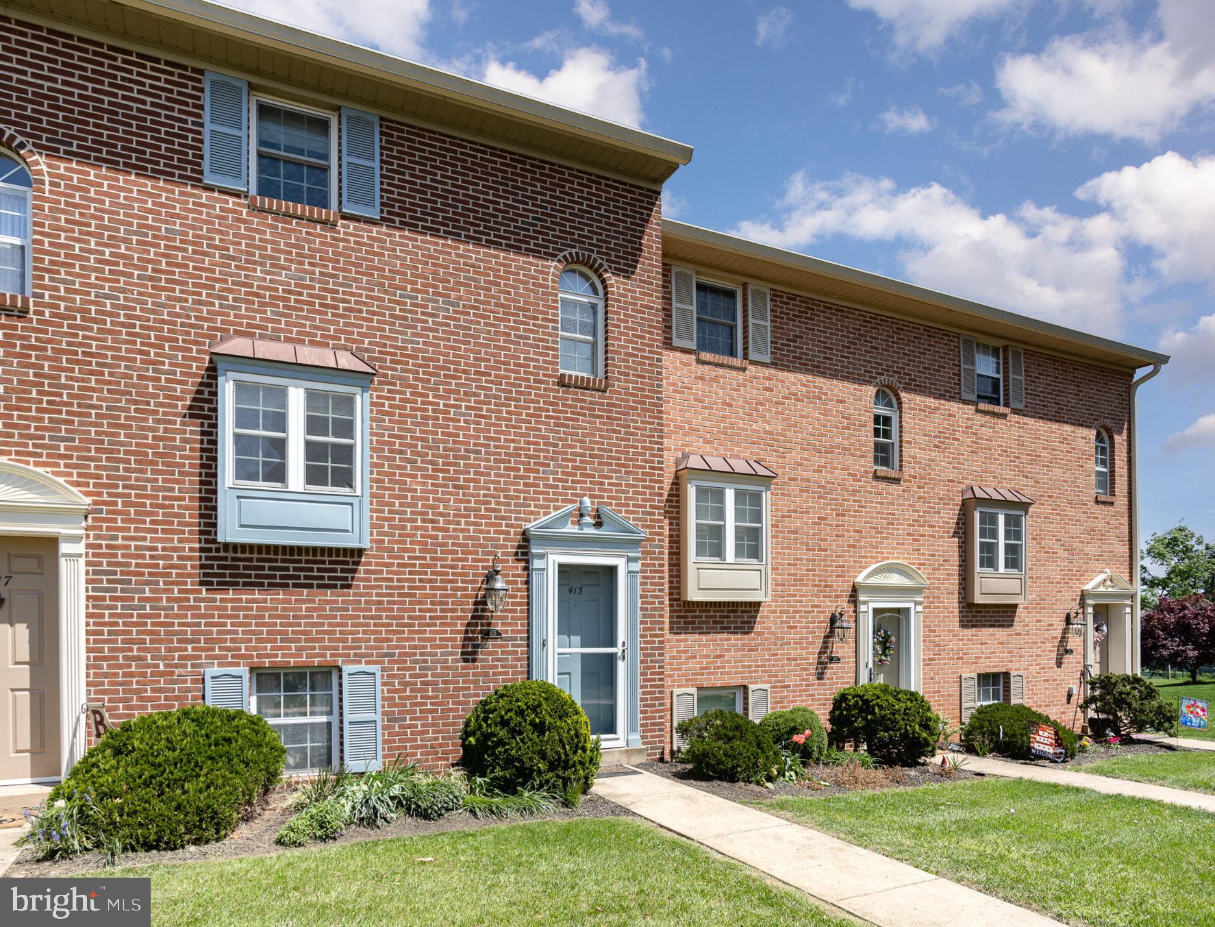 415 Weldon Drive York, PA 17404 - Photo 2 of 34 a front view of a house with a yard