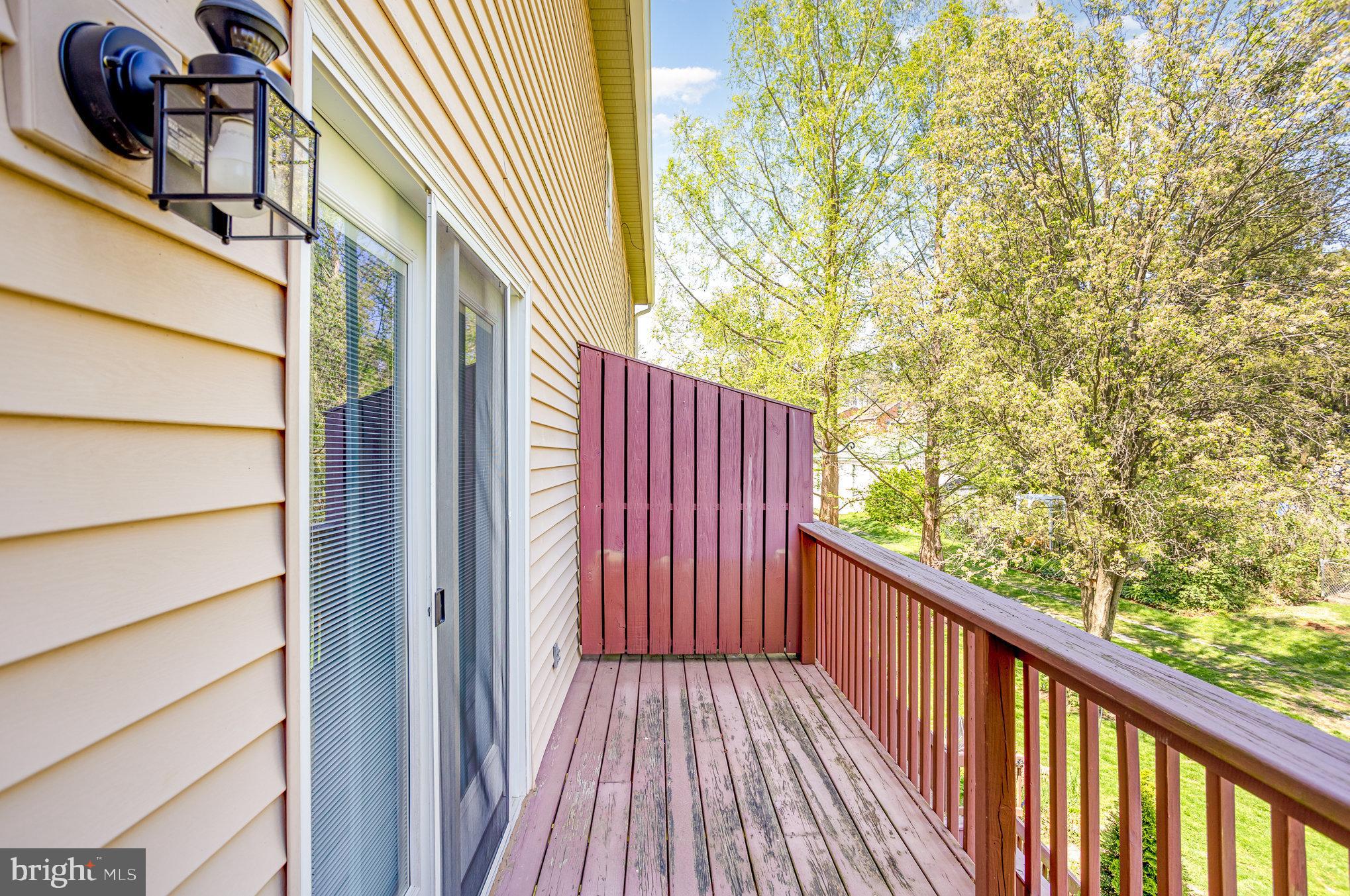 415 Weldon Drive York, PA 17404 - Photo 27 of 34 a view of a balcony with wooden floor and fence