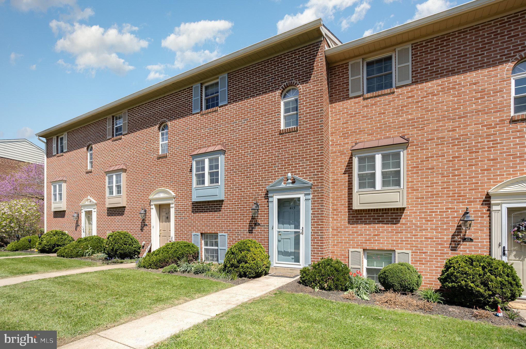 415 Weldon Drive York, PA 17404 - Photo 3 of 34 a front view of a house with a yard