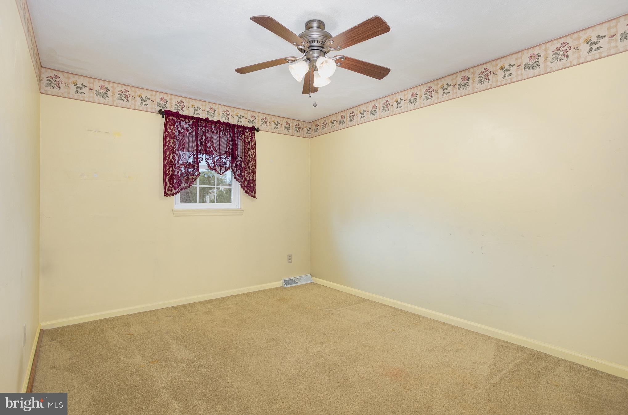 415 Weldon Drive York, PA 17404 - Photo 9 of 34 a view of a big room with a ceiling fan