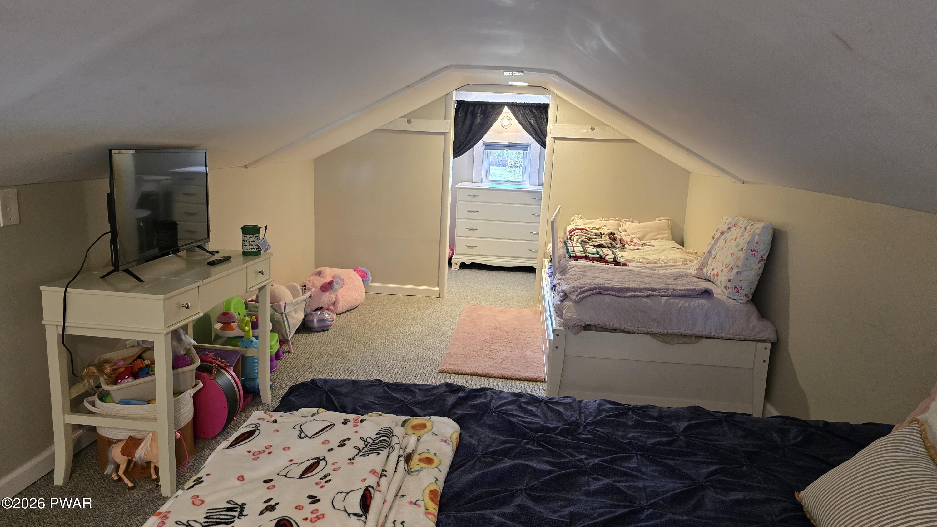 430 Griffith Road Tyler Hill, PA 18469 - Photo 19 of 31 a bedroom with a bed and wooden floor