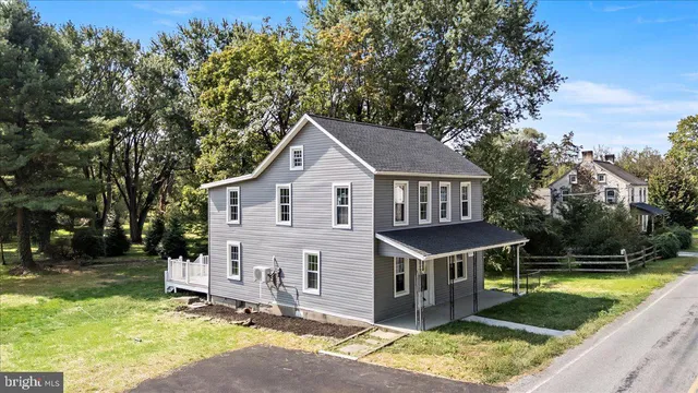 a aerial view of a house with a yard