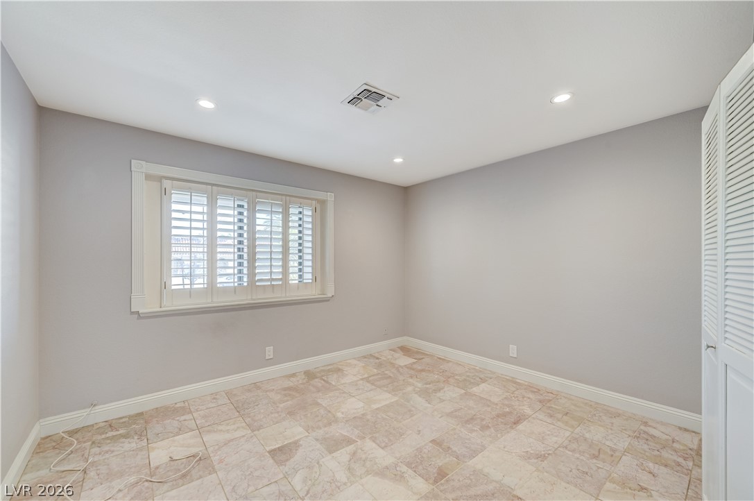 6635 Costa Brava Road Las Vegas, NV 89146 - Photo 42 of 59 Well-lit room featuring tile flooring and integrated ceiling spotlights.