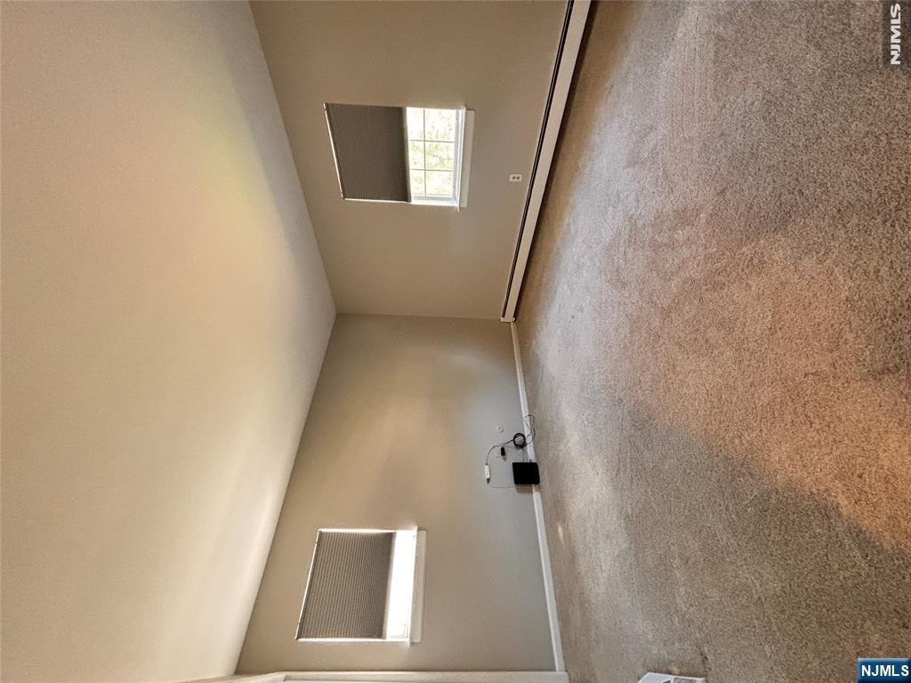 21 Wanamaker Avenue, Unit 1 Waldwick, NJ 07463 - Photo 8 of 13 an empty room with a window