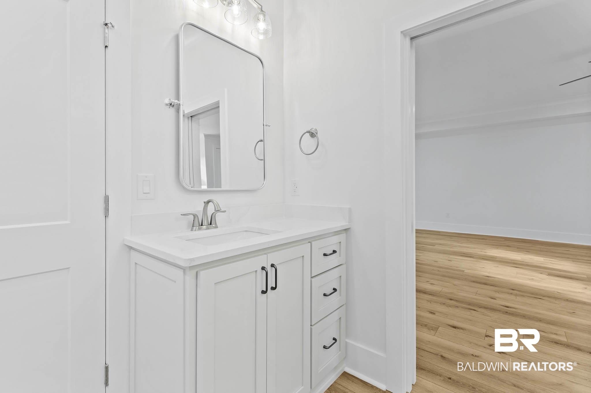 6656 Garrison Drive Daphne, AL 36527 - Photo 41 of 57 Bathroom with vanity and light wood-type flooring