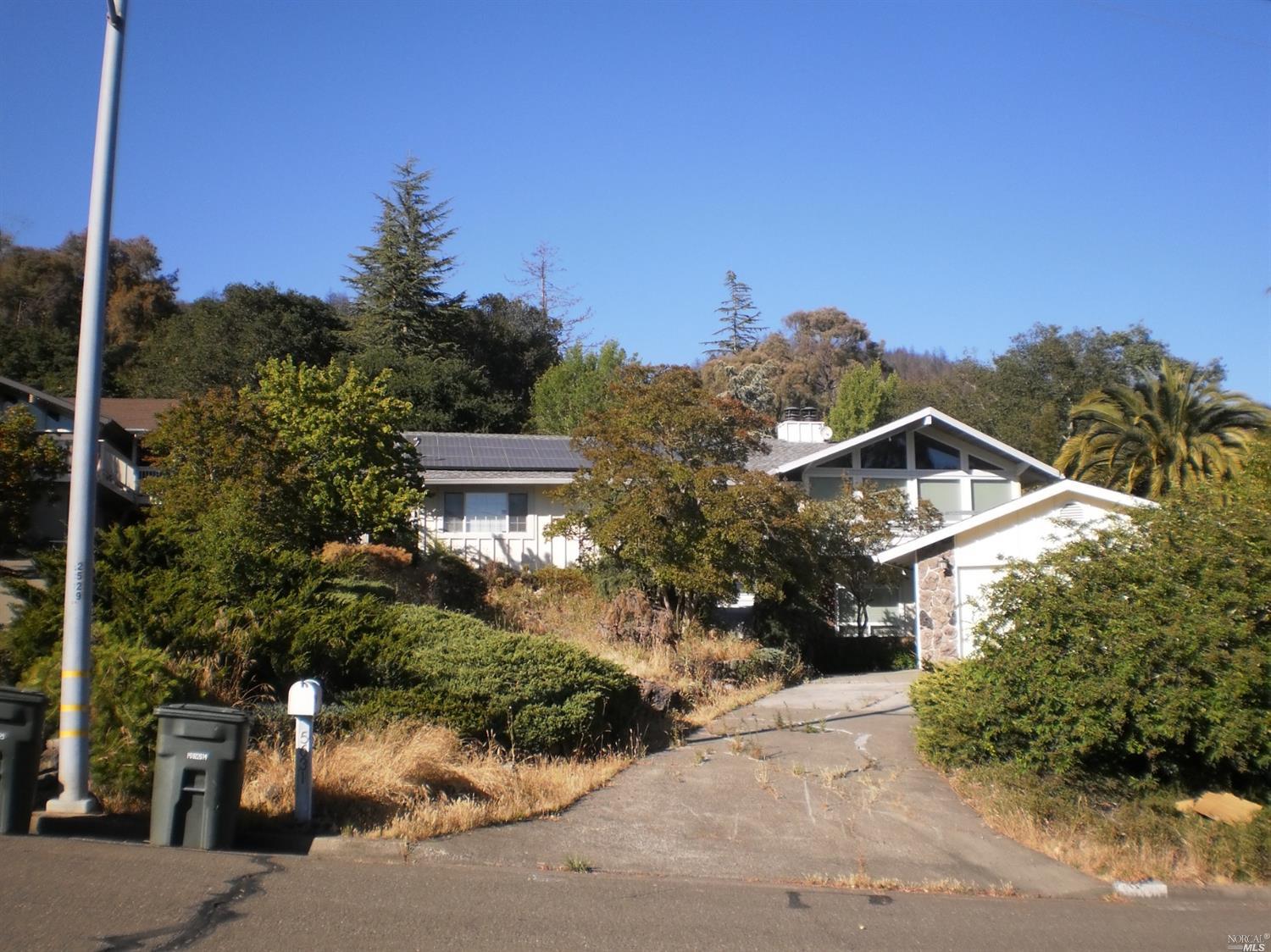 5631 Yerba Buena Road Santa Rosa, CA 95409 - Photo 1 of 1 a front view of a house with a yard