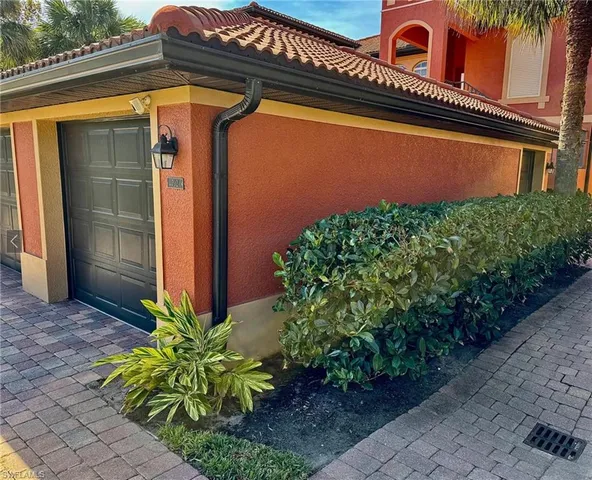 a view of a brick house with windows