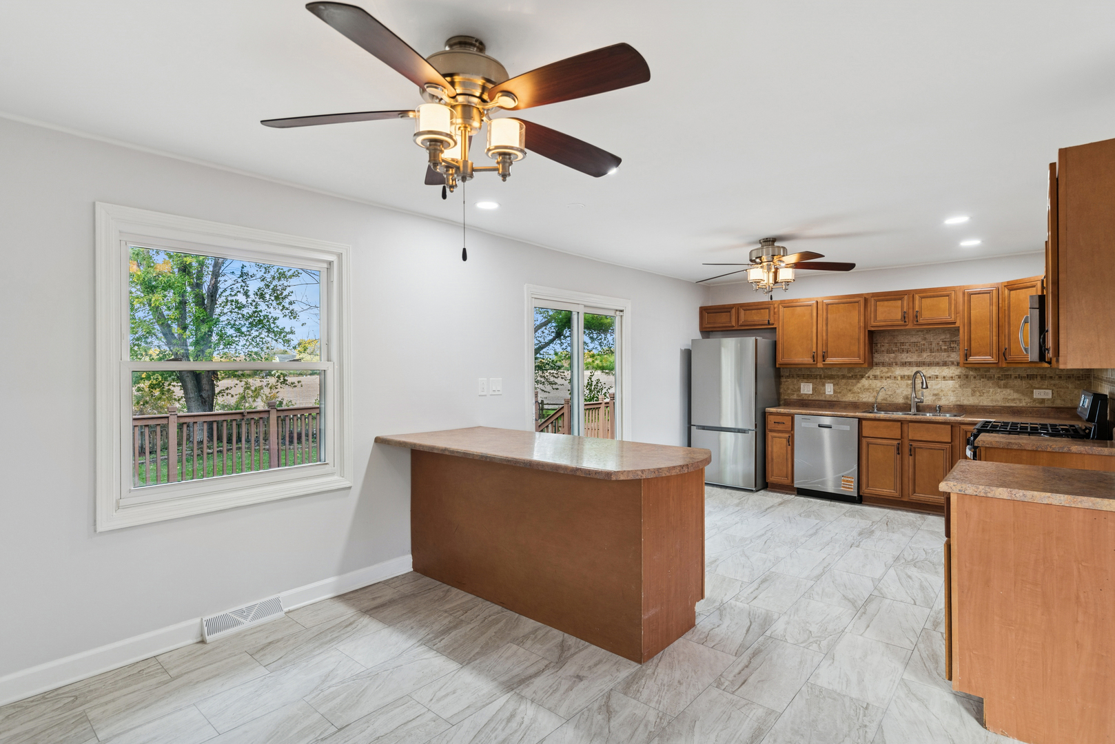 18 Greenview Road Oakwood Hills, IL 60013 - Photo 12 of 35 a living room with stainless steel appliances kitchen island granite countertop furniture and a kitchen view