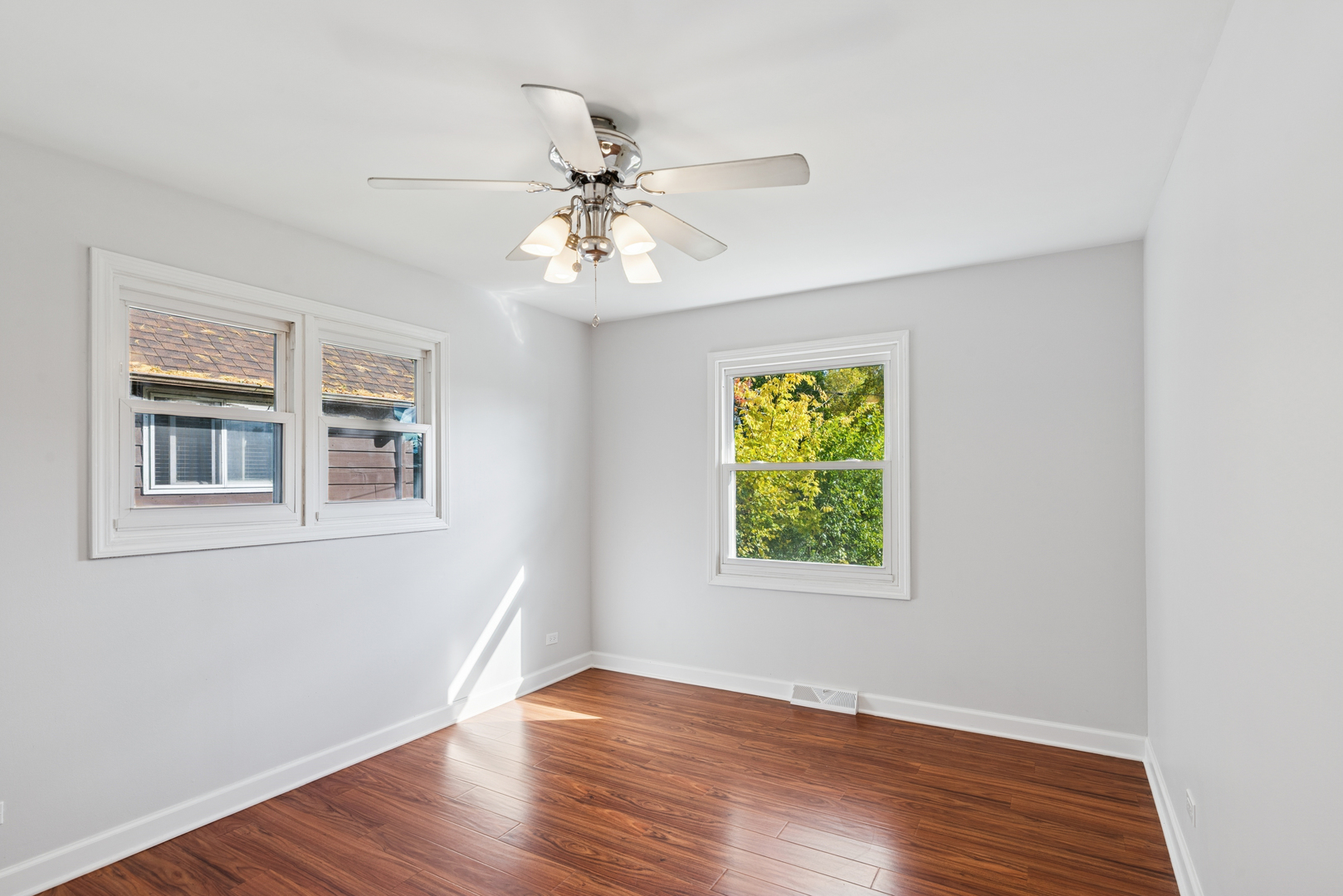 18 Greenview Road Oakwood Hills, IL 60013 - Photo 15 of 35 a view of an empty room with wooden floor and a window