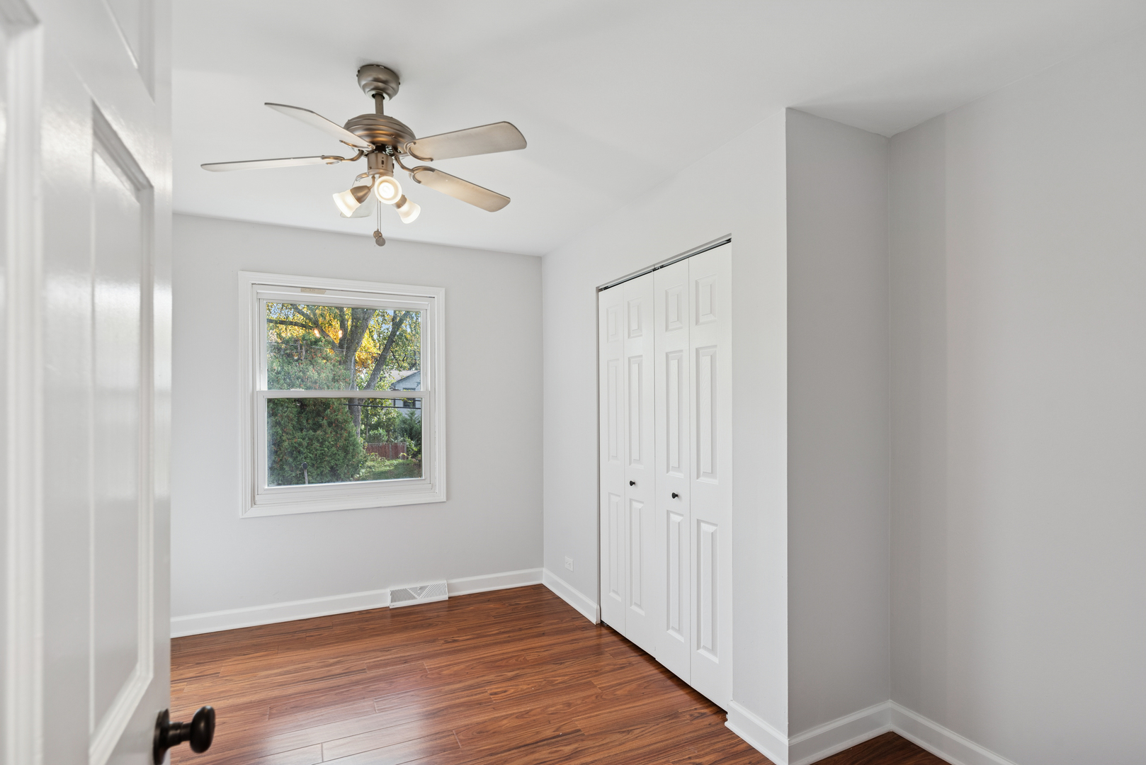 18 Greenview Road Oakwood Hills, IL 60013 - Photo 16 of 35 a view of an empty room with wooden floor and a window