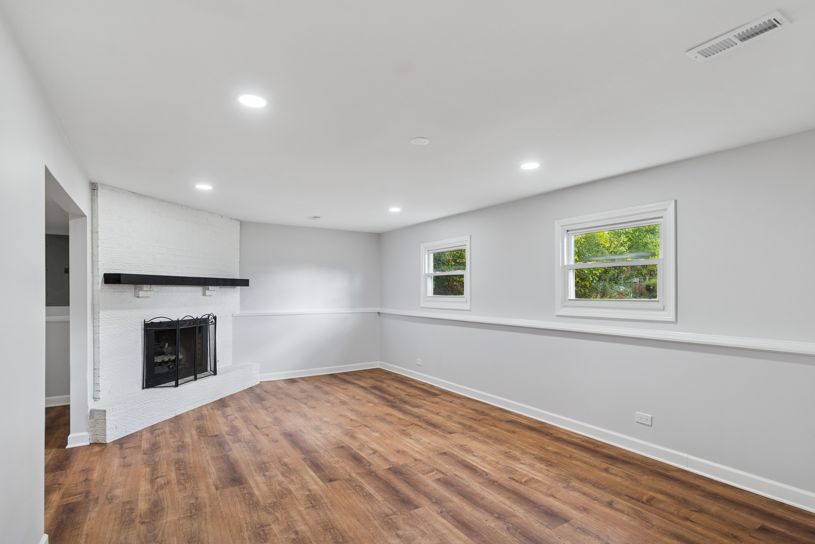 18 Greenview Road Oakwood Hills, IL 60013 - Photo 19 of 35 a view of empty room with a fireplace and a window