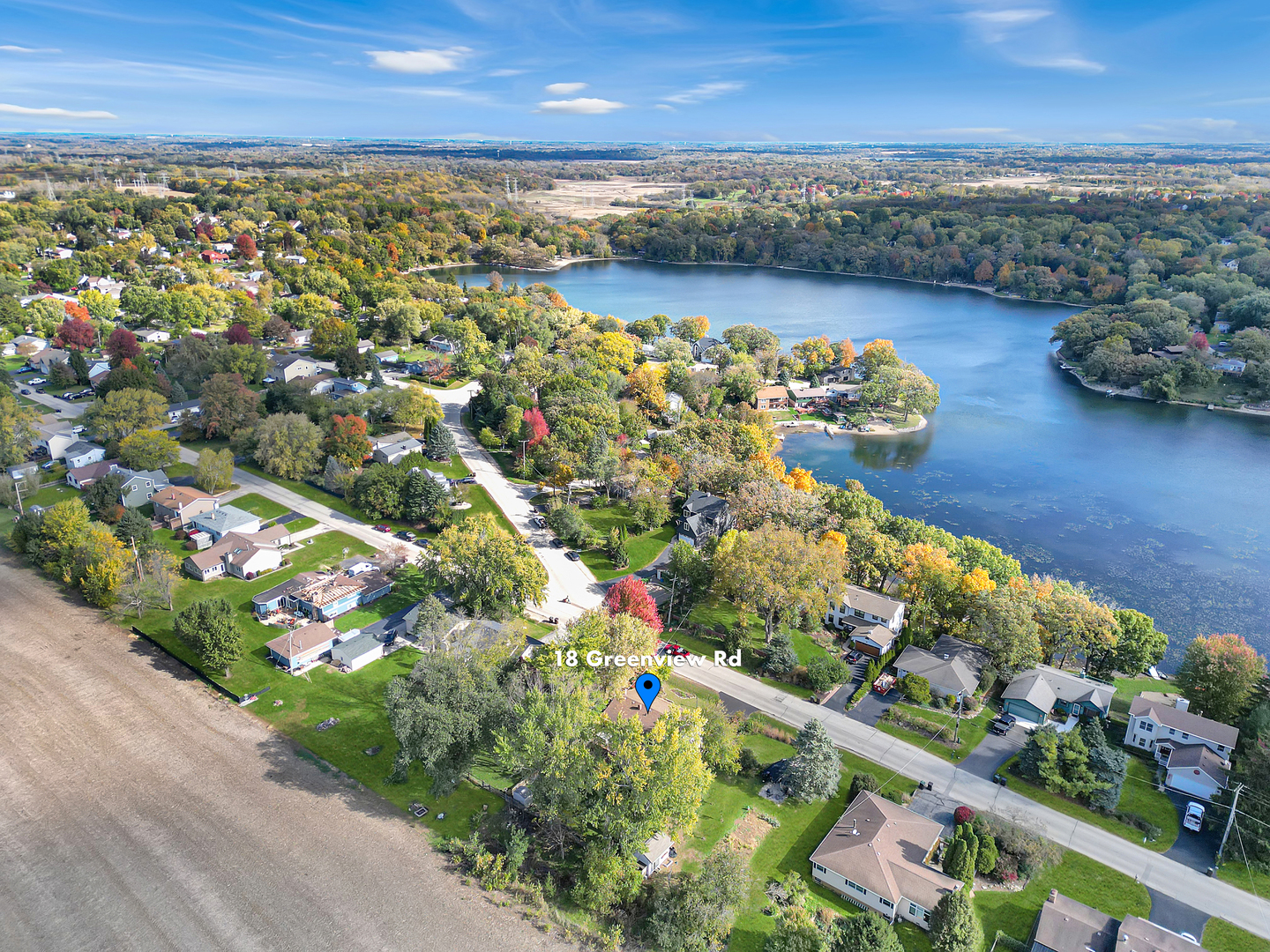 18 Greenview Road Oakwood Hills, IL 60013 - Photo 4 of 35 an aerial view of a city with lots of residential buildings ocean and mountain view in back