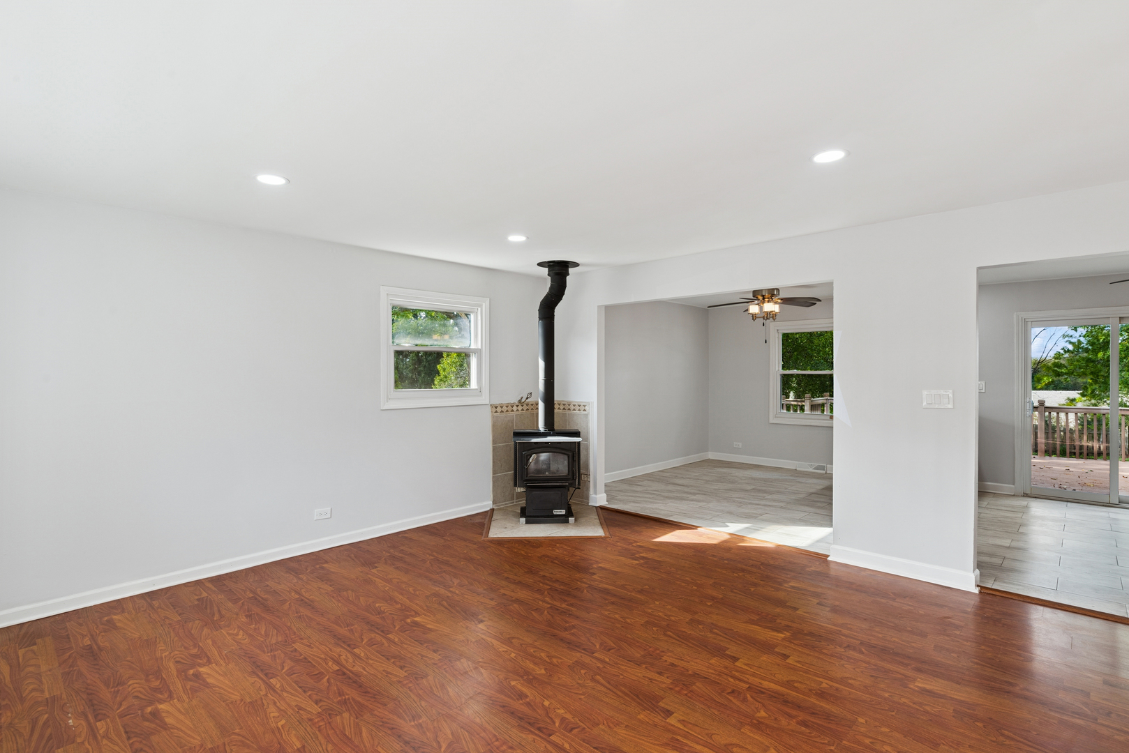 18 Greenview Road Oakwood Hills, IL 60013 - Photo 7 of 35 a view of a livingroom with wooden floor and a fireplace