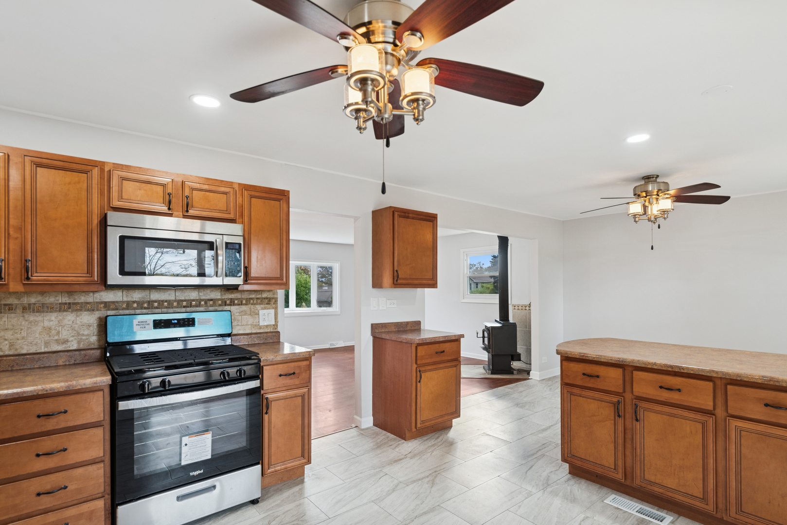 18 Greenview Road Oakwood Hills, IL 60013 - Photo 8 of 35 a kitchen with stainless steel appliances granite countertop a stove and a sink