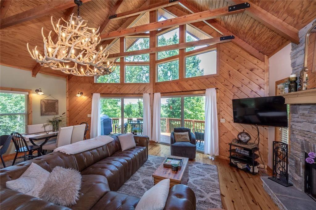 1328 Birch Lane Ranger, GA 30734 - Photo 11 of 33 a living room with furniture a flat screen tv and a large window