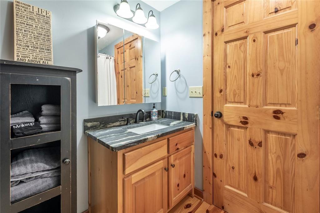 1328 Birch Lane Ranger, GA 30734 - Photo 17 of 33 a bathroom with a sink vanity and a mirror