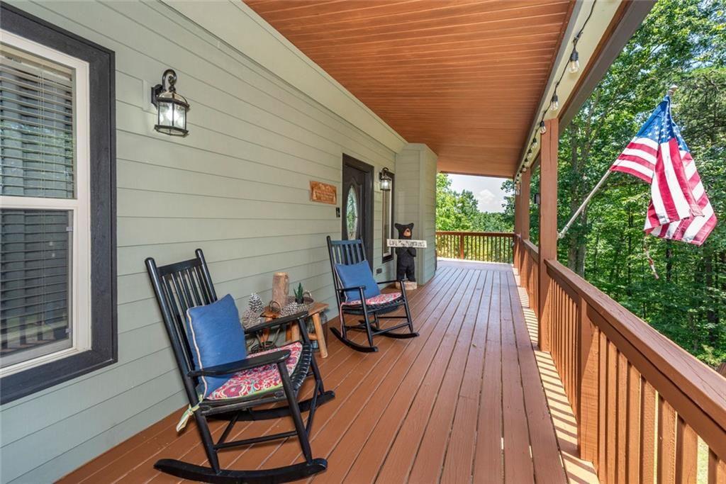 1328 Birch Lane Ranger, GA 30734 - Photo 4 of 33 a view of balcony with wooden floor and outdoor seating