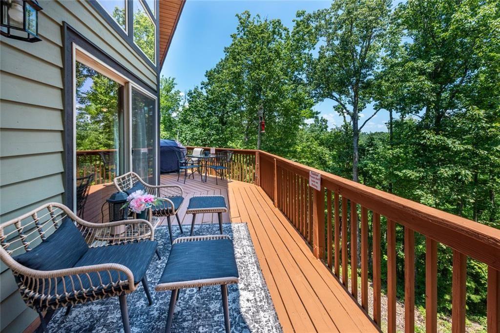 1328 Birch Lane Ranger, GA 30734 - Photo 5 of 33 a balcony with wooden floor potted plants and outdoor seating