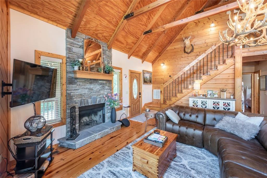 1328 Birch Lane Ranger, GA 30734 - Photo 7 of 33 a living room with furniture a fireplace and a flat screen tv