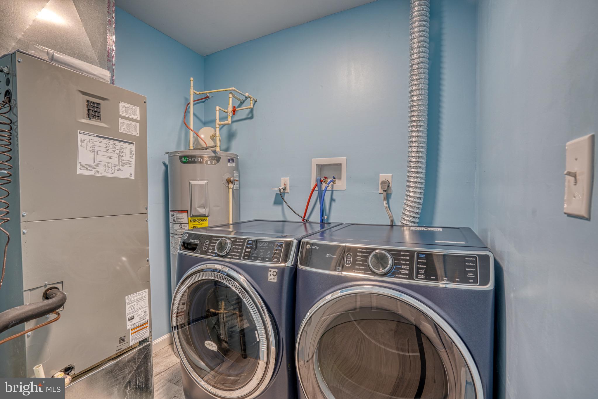 18 Oak Street Cambridge, MD 21613 - Photo 28 of 43 a utility room with dryer and washer