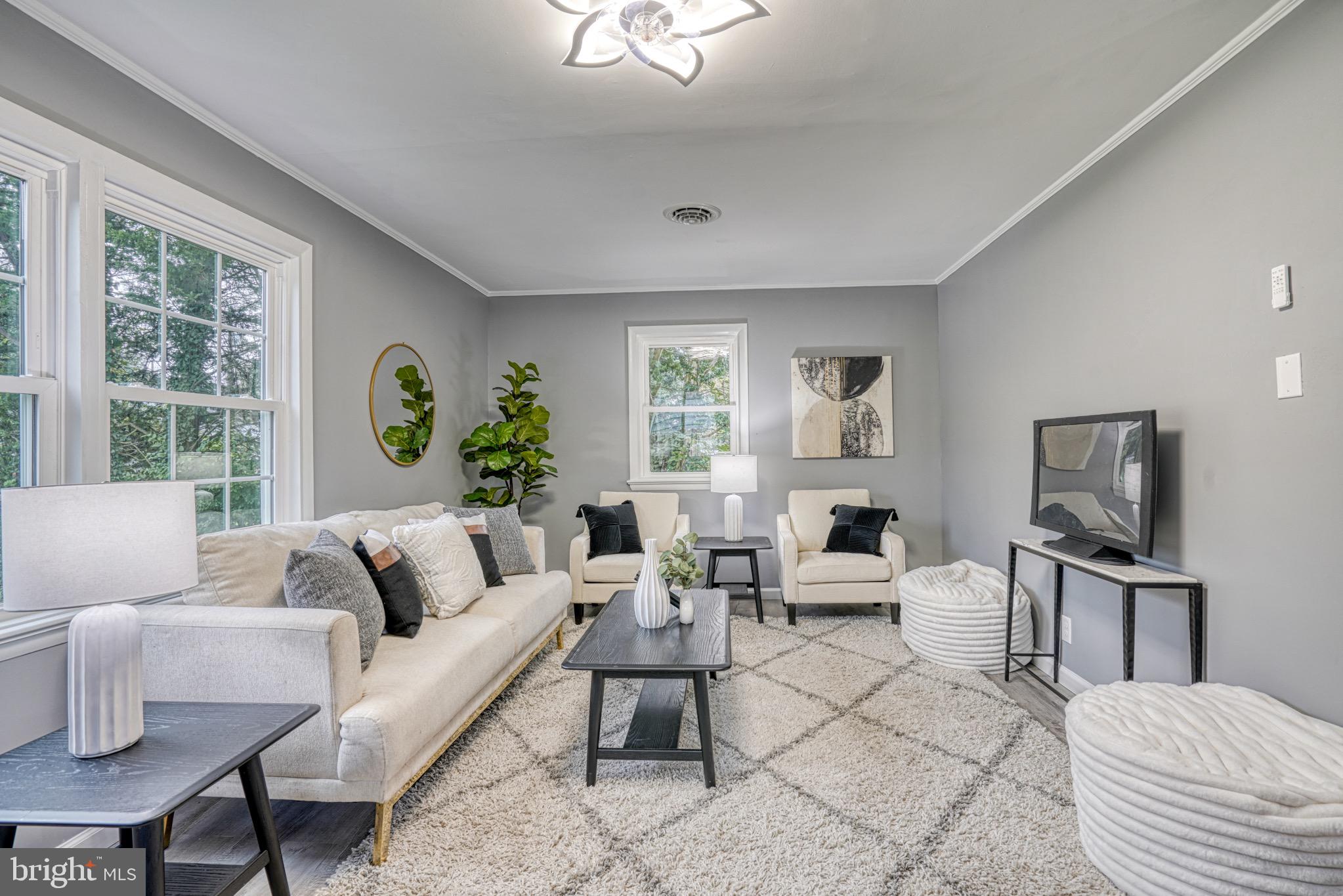 18 Oak Street Cambridge, MD 21613 - Photo 3 of 43 a living room with furniture and a large window