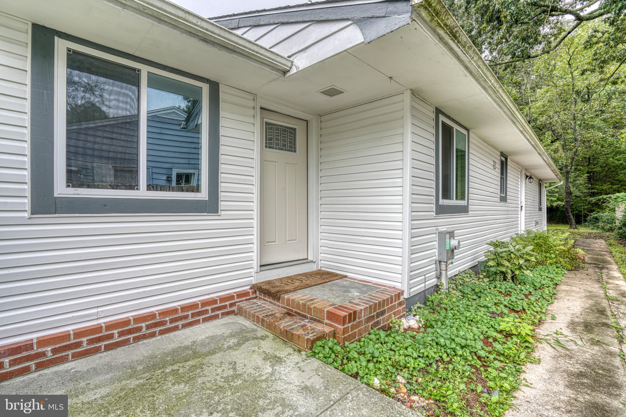 18 Oak Street Cambridge, MD 21613 - Photo 35 of 43 a view of a house with a yard and a garage