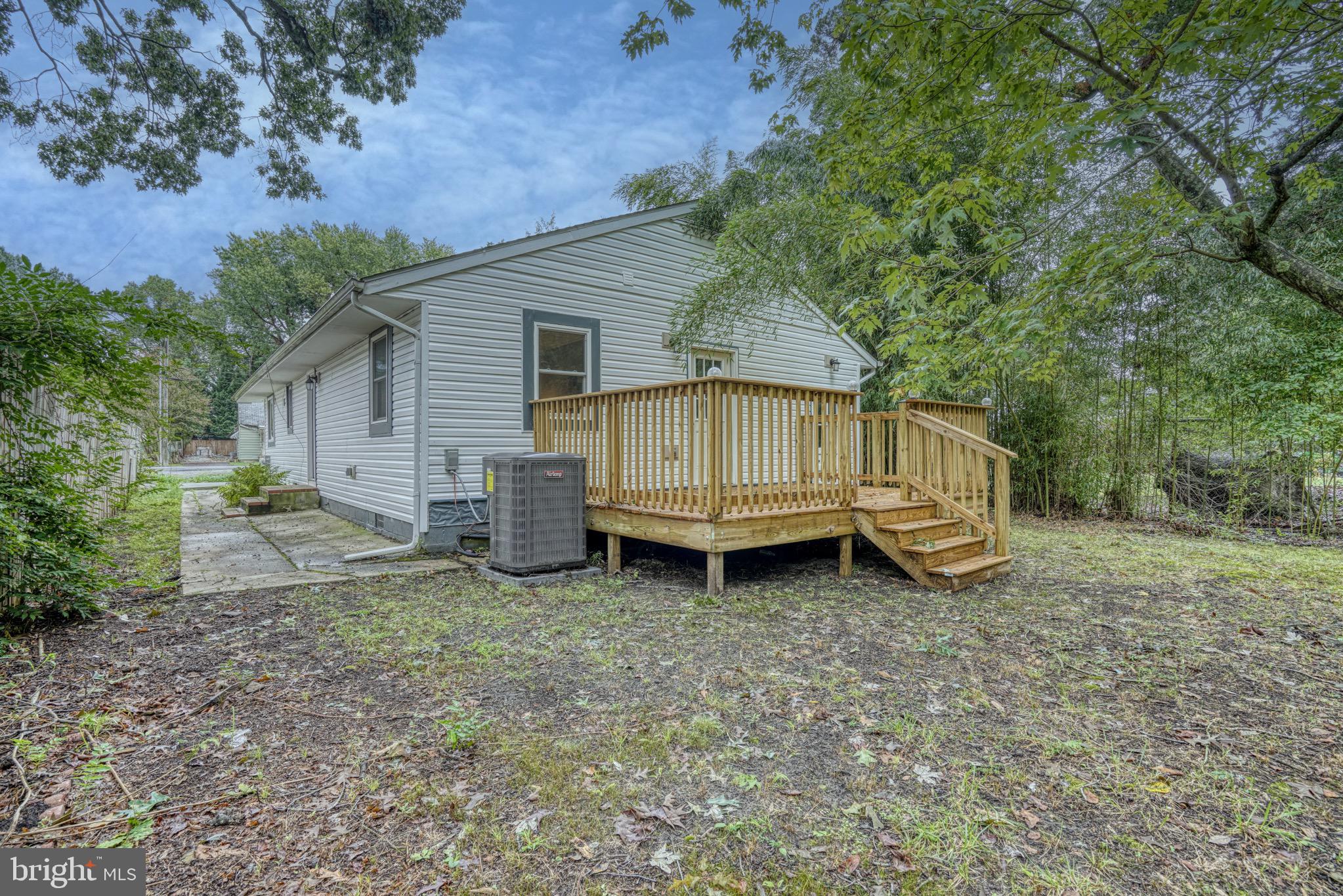 18 Oak Street Cambridge, MD 21613 - Photo 37 of 43 a view of a house with a yard and a wooden deck