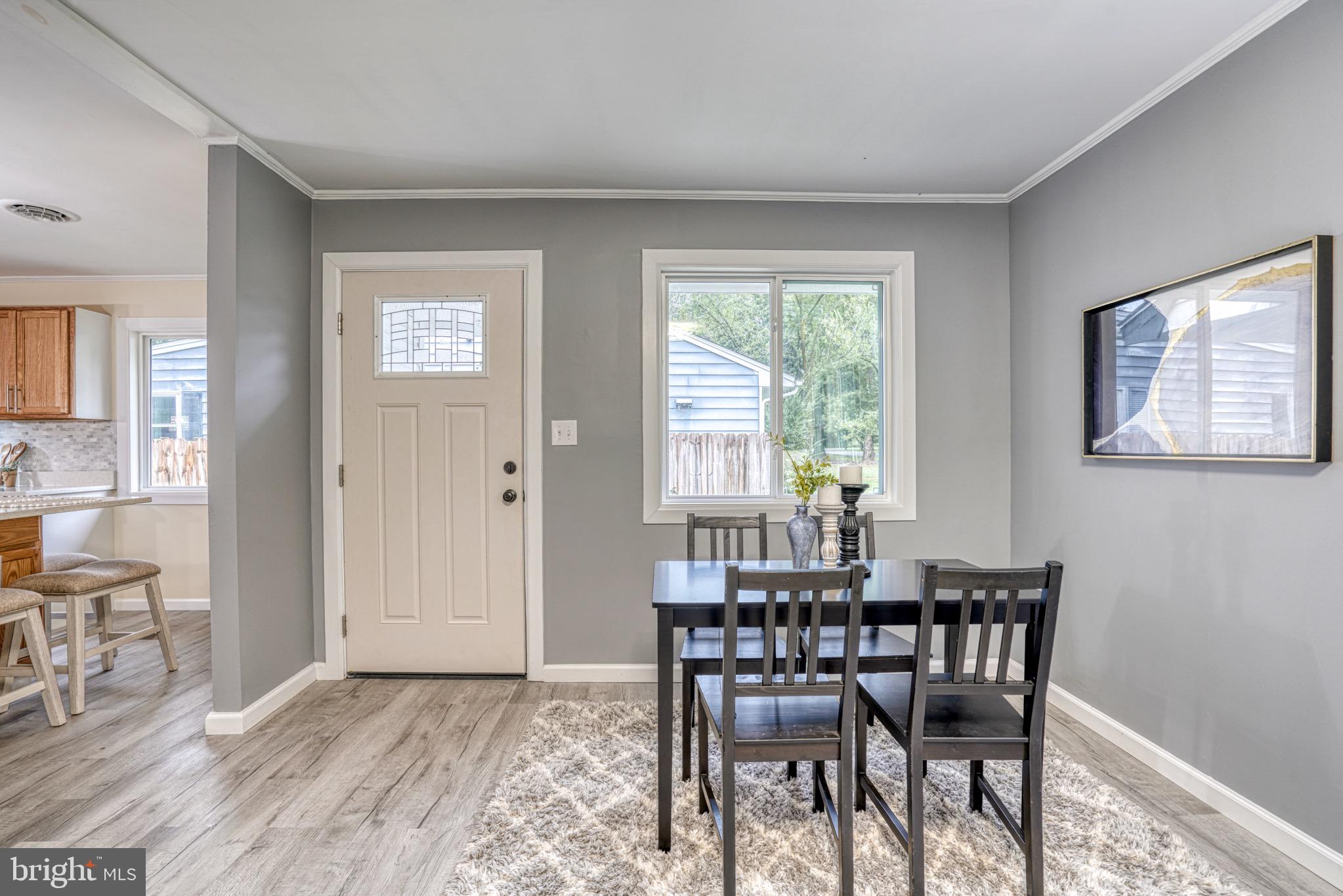 18 Oak Street Cambridge, MD 21613 - Photo 4 of 43 a view of a dining room with furniture and a window