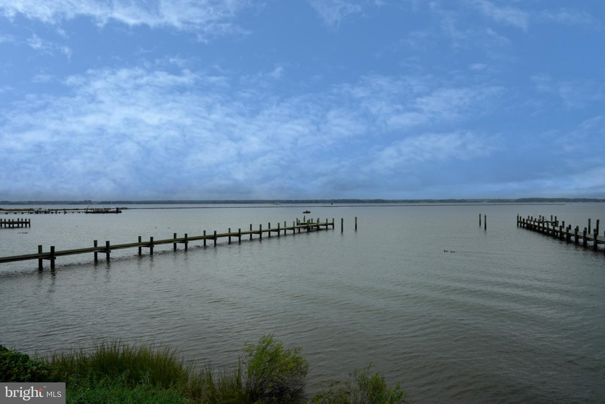 18 Oak Street Cambridge, MD 21613 - Photo 43 of 43 a view of a ocean with a building in the background