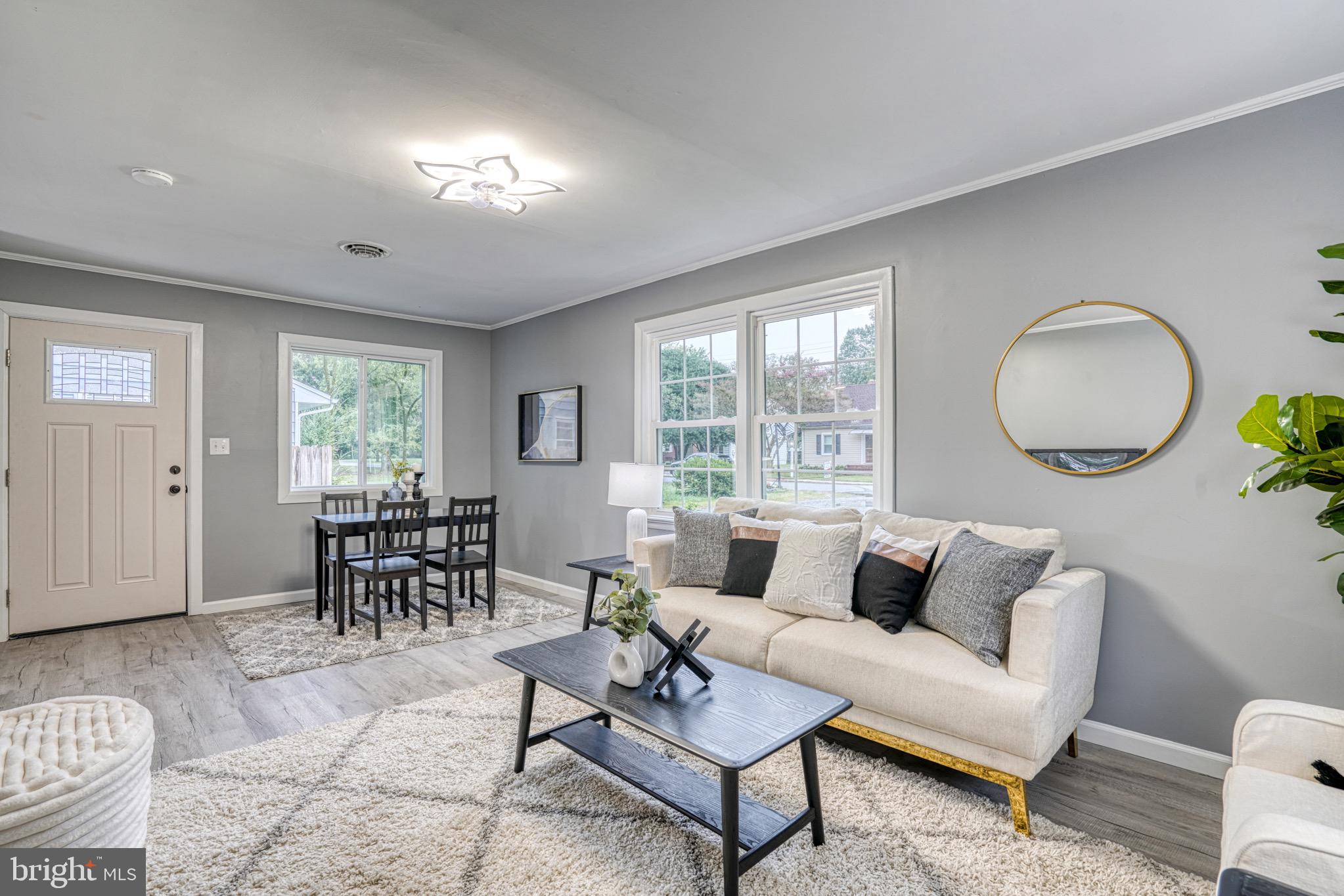 18 Oak Street Cambridge, MD 21613 - Photo 5 of 43 a living room with furniture and a large window