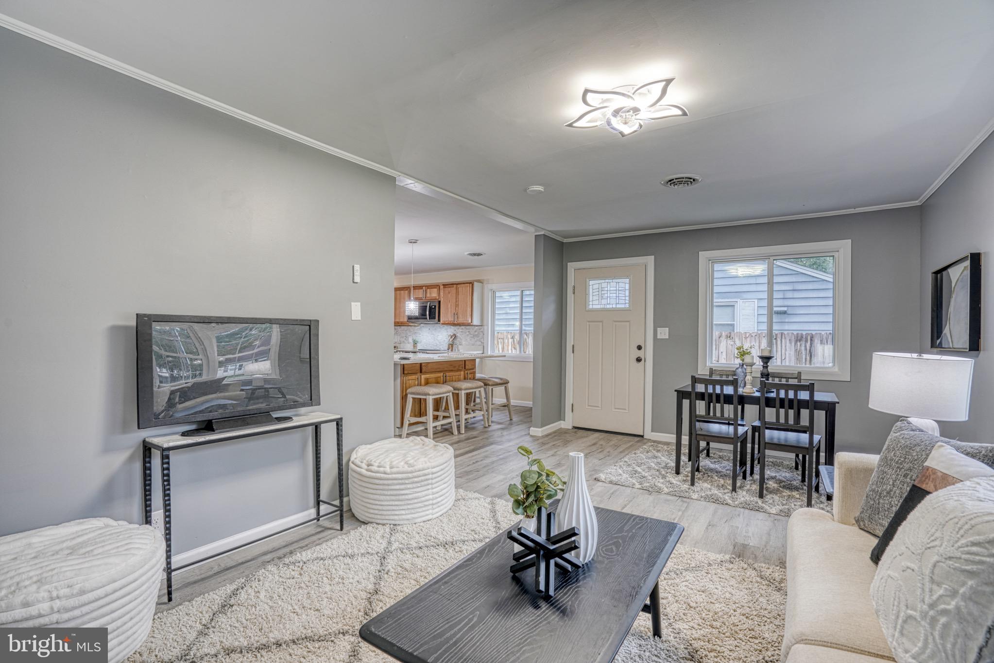 18 Oak Street Cambridge, MD 21613 - Photo 6 of 43 a living room with furniture and view of kitchen